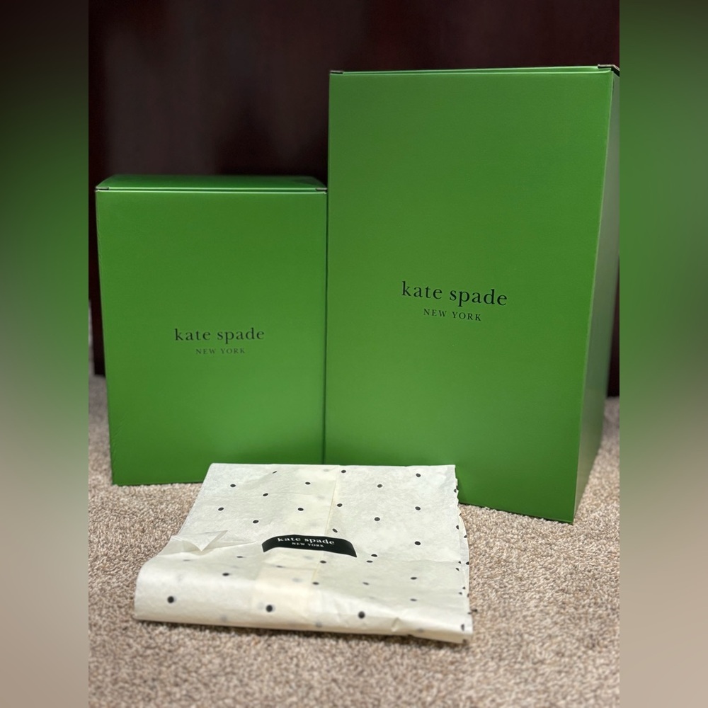 Two Kate spade boxes and decorative Kate Spade paper